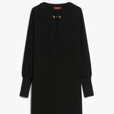 Short dress in heavy cady, featuring a tunic silhouette with long batwing sleeves and wide knit cuffs. Finished with pockets inserted in the sides and a round neckline fastened with a jewelled stud button.