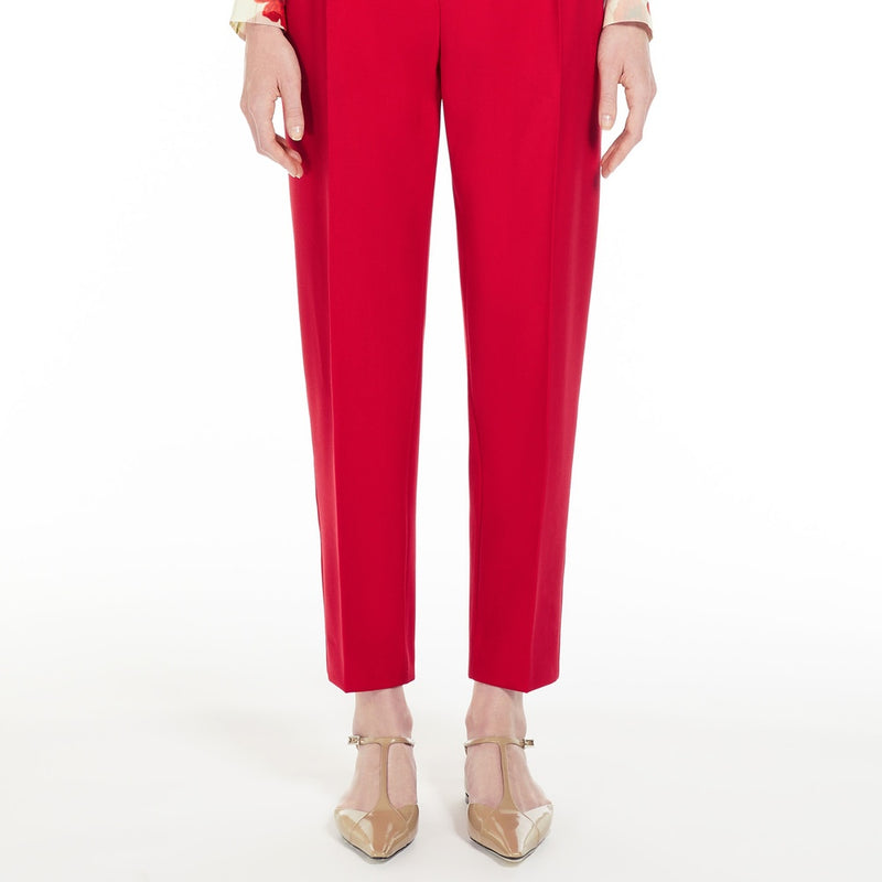 Wool satin carrot-leg trousers.