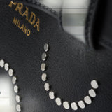 Prada Buckle medium leather bag with appliqués