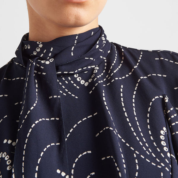 Printed sablé mini-dress with scarf collar