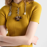 Short-sleeved wool knit sweater with pendants