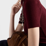 Short-sleeved wool sweater with pendants