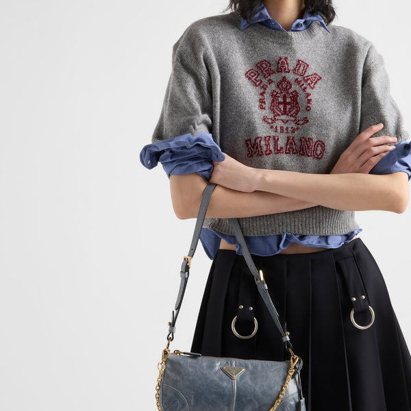 Pleated gabardine miniskirt with metal rings