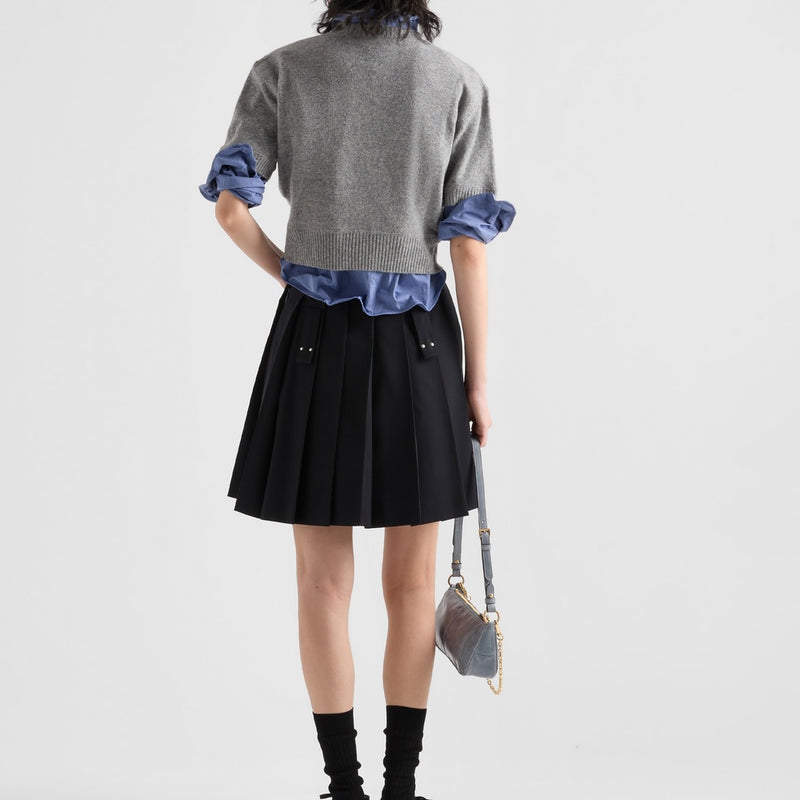 Pleated gabardine miniskirt with metal rings