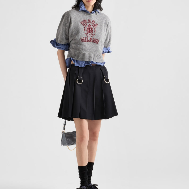 Pleated gabardine miniskirt with metal rings