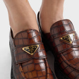 Chocolate crocodile-print leather loafers