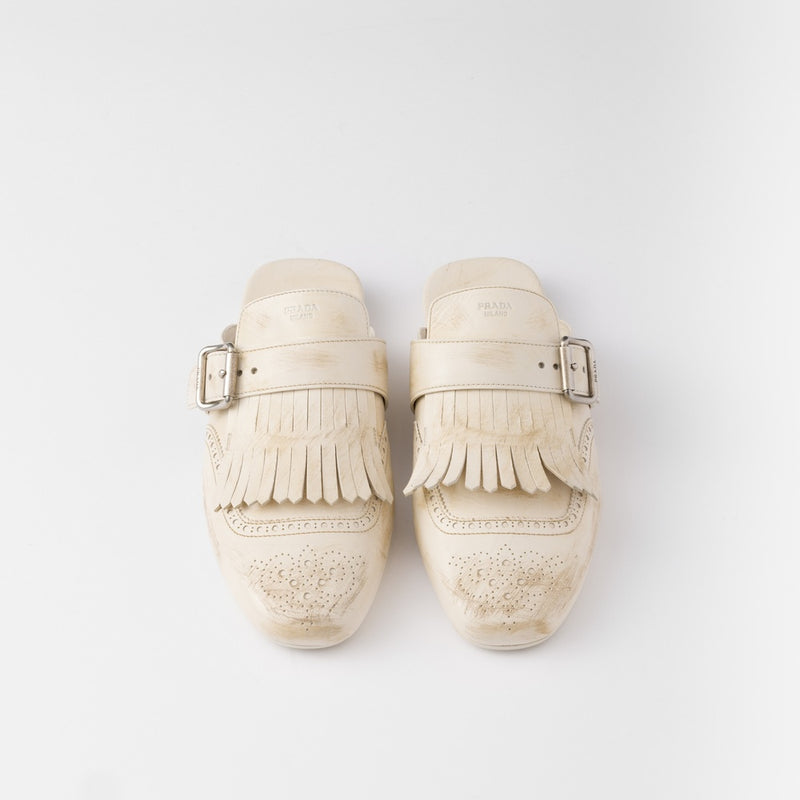 Shuffle fringed leather mules
