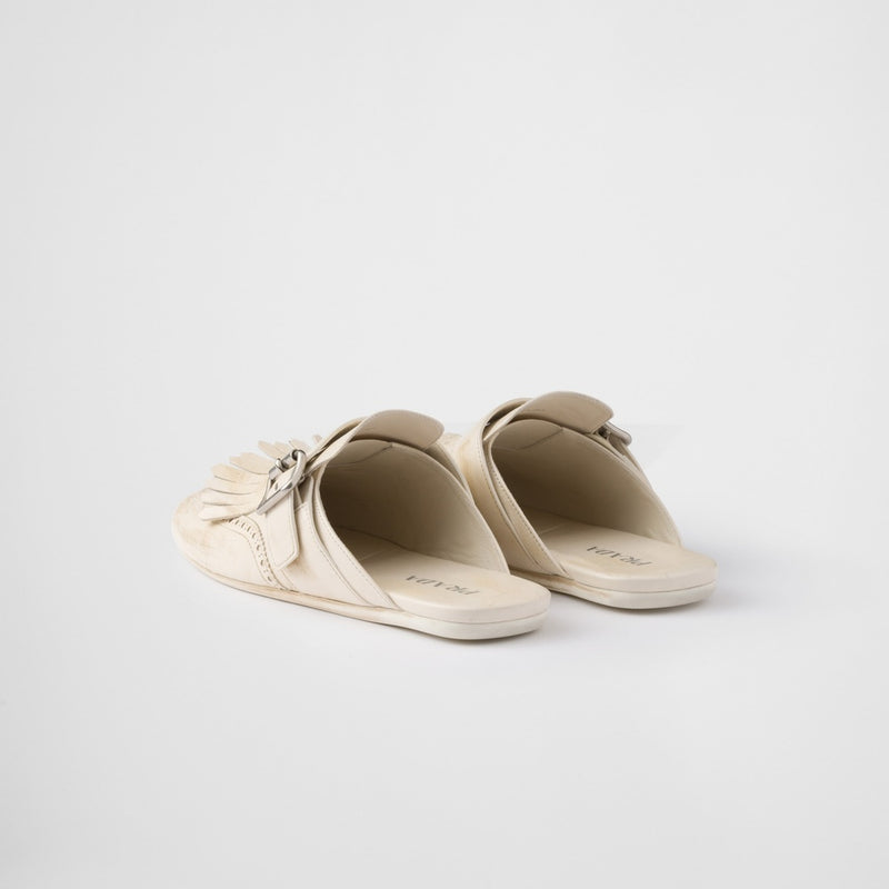 Shuffle fringed leather mules