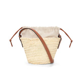 Drawstring bucket bag in palm leaf and calfskin