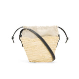 Drawstring bucket bag in palm leaf and calfskin