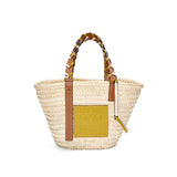 Basket bag in palm leaf with a braided handle in calfskin