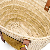 Basket bag in palm leaf with a braided handle in calfskin