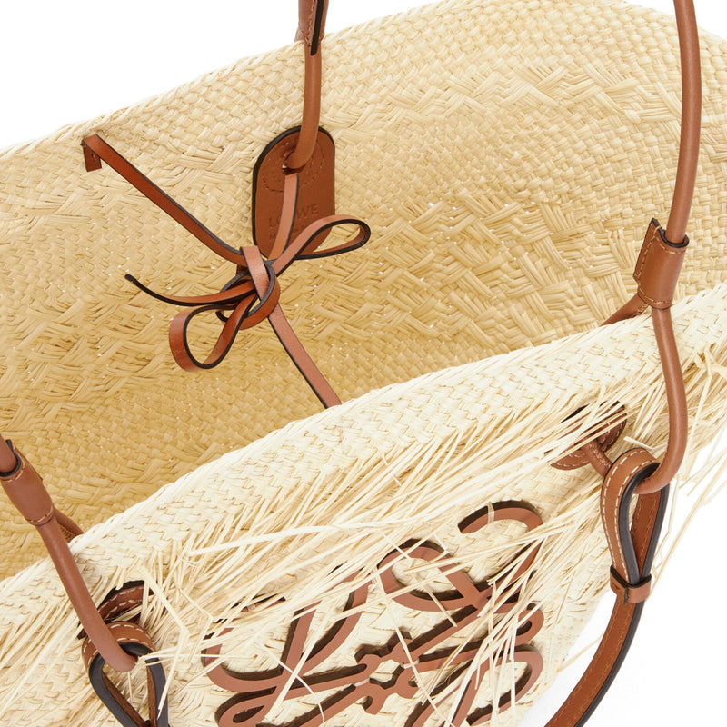 Frayed Anagram basket bag in iraca palm and calfskin