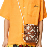 Anagram cut-out crossbody in classic calfskin and canvas